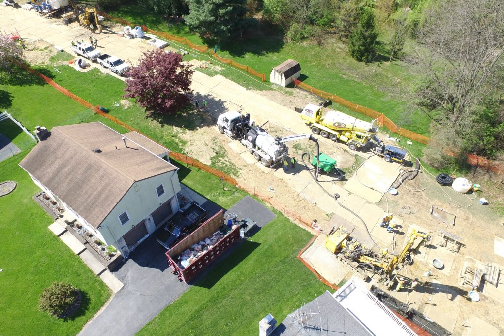 DJI_0070_lisa_drive_cropped Mariner East 2 pipeline construction crews work in the backyards of homes on Lisa Drive in West Whiteland Township, Chester County, on May 2. Sinkholes that opened in the area prompted the state's Public Utility Commission to order that an existing pipeline nearby, the Mariner East 1, be shut down until it could be determined that the sinkholes didn't threaten its safety. (Marie Cusick/StateImpact Pennsylvania)