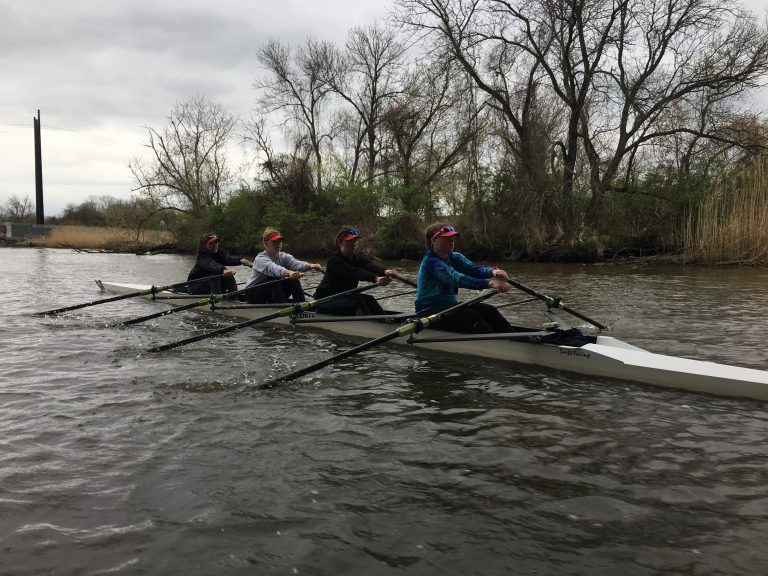 Members of the Newport Rowing Club make their way down the Christina River near Wilmington. (Mark Eichmann/WHYY)