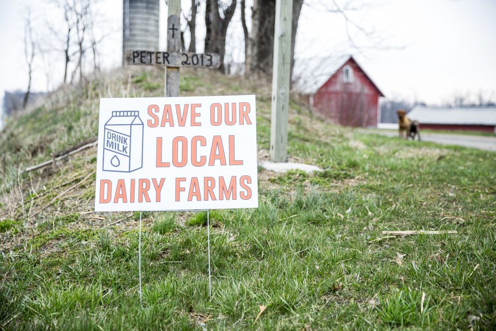 A yard sign that reads 