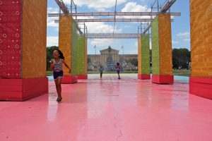Children run through the mister at the Eakins Oval pop-up park.