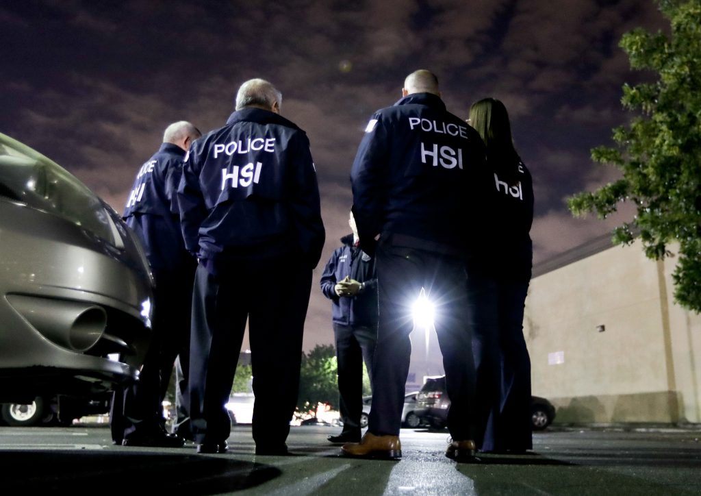 U.S. Immigration and Customs Enforcement agents gather before serving a employment audit notice at a 7-Eleven convenience store in Los Angeles in January. U.S. Immigration and Customs Enforcement agents gather before serving a employment audit notice at a 7-Eleven convenience store in Los Angeles in January.