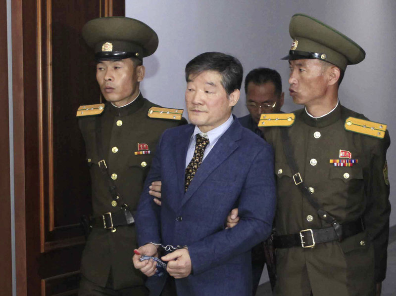 ap_18072174062195-0b8e49e47bc0d40acae566863cd06edeea9d94ca-s800-c85 Kim Dong Chul (center) a U.S. citizen detained in North Korea, is escorted from a courtroom after his trial in Pyongyang, North Korea in April 2016. He is one of three Americans currently detained by the Pyongyang regime. (Kim Kwang Hyon/AP)