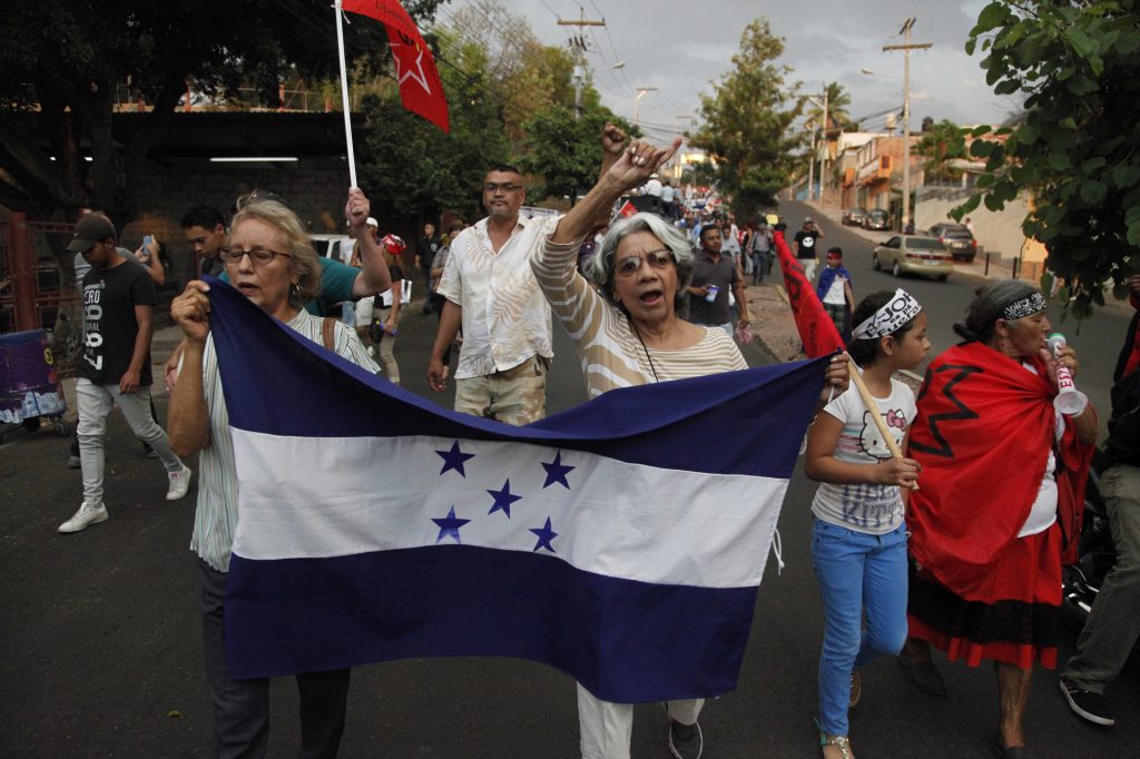 Members of the opposition to the administration of Honduran President Juan Orlando Hernandez march on Friday to protest the U.S. government’s decision to end the Temporary Protected Status designation for nearly 57,000 people from Honduras. Hernandez called the decision a sovereign issue for Washington, adding that “we deeply lament it.” Members of the opposition to the administration of Honduran President Juan Orlando Hernandez march on Friday to protest the U.S. government's decision to end the Temporary Protected Status designation for nearly 57,000 people from Honduras. Hernandez called the decision a sovereign issue for Washington, adding that