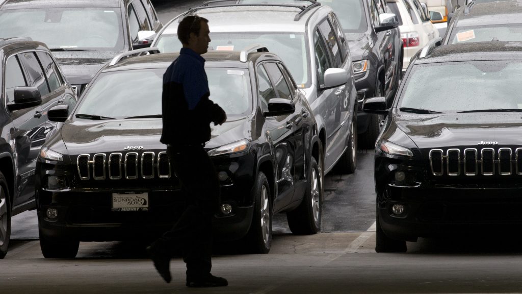A worker on a Chrysler car lot passes lines of Jeeps in 2014. The House on Tuesday passed a measure to roll back guidance on auto lending issued by the Consumer Financial Protection Bureau. A worker on a Chrysler car lot passes lines of Jeeps in 2014. The House on Tuesday passed a measure to roll back guidance on auto lending issued by the Consumer Financial Protection Bureau. (Gregory Bull/AP)