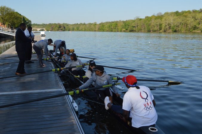 The Philly Council Dad Vail crew departs the dock during practice on the Schuylkill Wednesday morning (Tom MacDonald/WHYY)