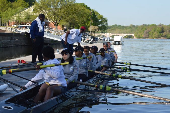 The Philly Council Dad Vail crew departs the dock during practice on the Schuylkill Wednesday morning (Tom MacDonald/WHYY)