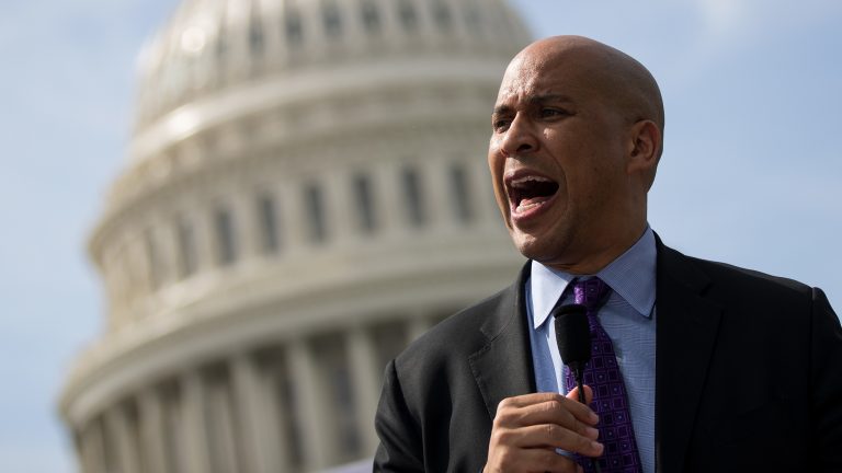 Sen. Cory Booker (D-NJ) speaks during a September 2017 news conference. Booker has released plan that would establish job guarantee programs in 15 communities. (Drew Angerer/Getty Images)