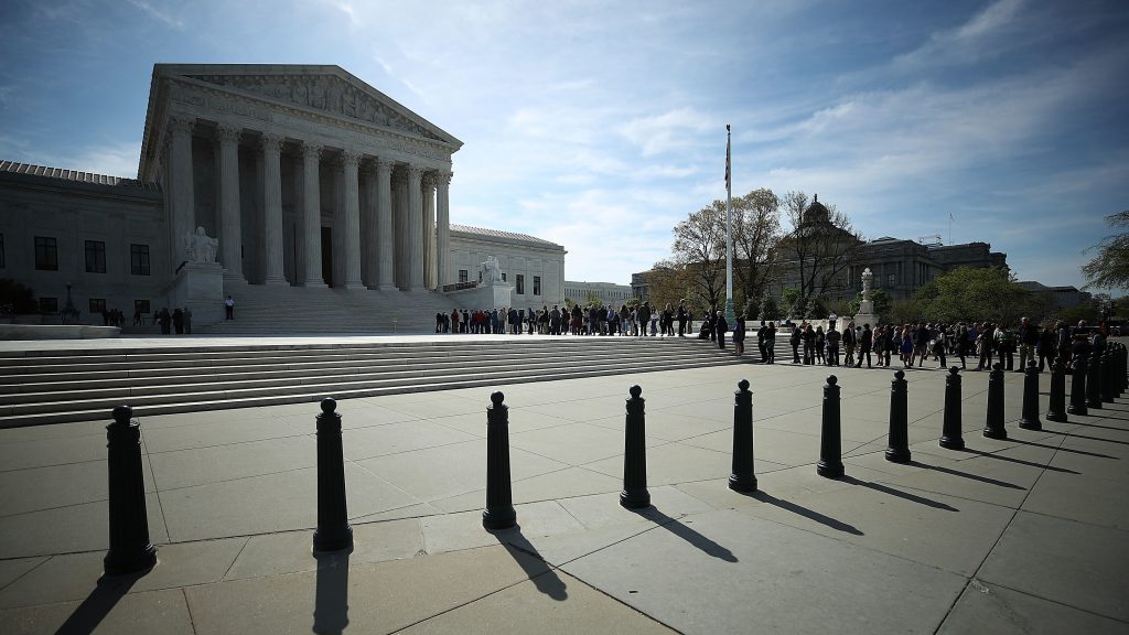 People wait in line to enter the U.S. Supreme Court last month. The court sided with businesses not allowing class-action lawsuits for federal labor violations. People wait in line to enter the U.S. Supreme Court last month. The court sided with businesses not allowing class-action lawsuits for federal labor violations.