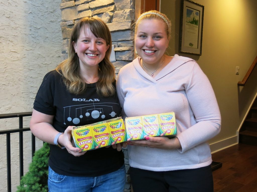 Johanna Humphrey, left, ended up with 24 boxes of crayons she didn’t need. She gave them to teacher Laura Smith, right, through the Buy Nothing Project. It encourages people to share without money changing hands. Johanna Humphrey, (left), ended up with 24 boxes of crayons she didn't need. She gave them to teacher Laura Smith, (right), through the Buy Nothing Project. It encourages people to share without money changing hands.
(Jeff Brady/NPR)