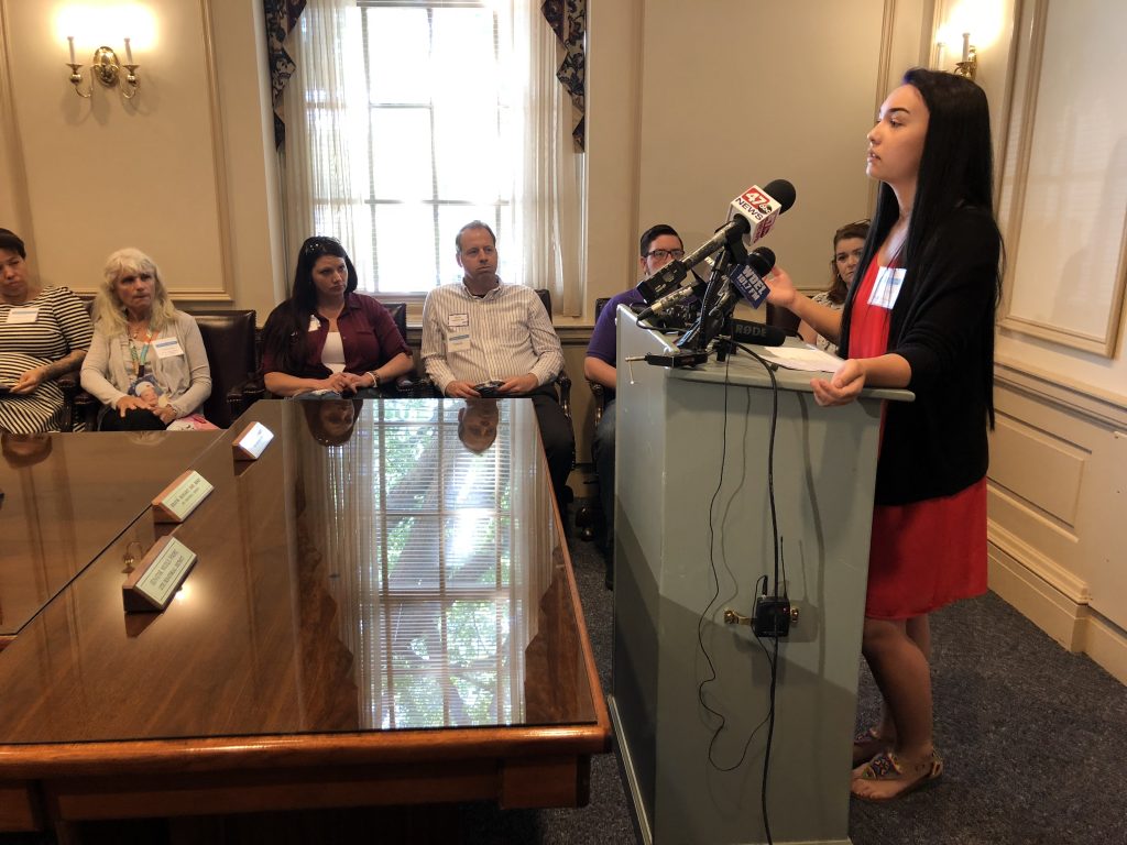 opiod initiatives Emily Polecaro, 18, calls for a public recovery high school in Delaware at Legislative Hall in Dover Tuesday. (Shirley Min/WHYY)