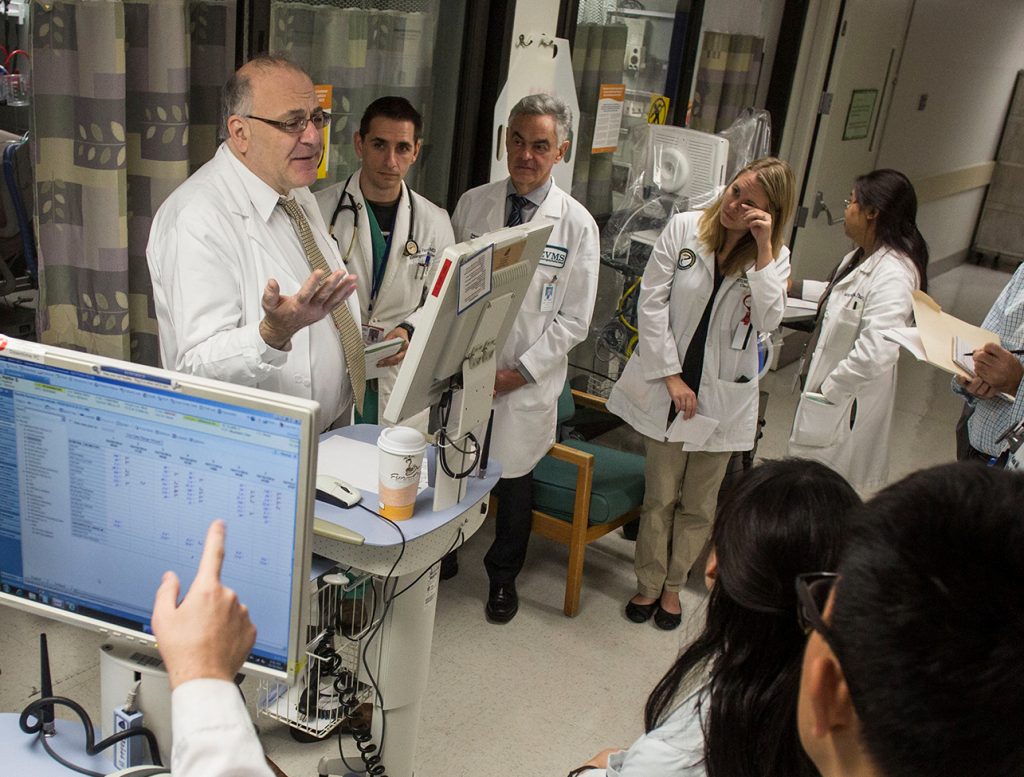 Dr. Paul Marik (left) discusses patient care with medical students and resident physicians during morning rounds at Sentara Norfolk General Hospital in 2014 in Norfolk, Va. Dr. Paul Marik (left) discusses patient care with medical students and resident physicians during morning rounds at Sentara Norfolk General Hospital in 2014 in Norfolk, Va. (Jay Westcott for The Washington Post/Getty Images)