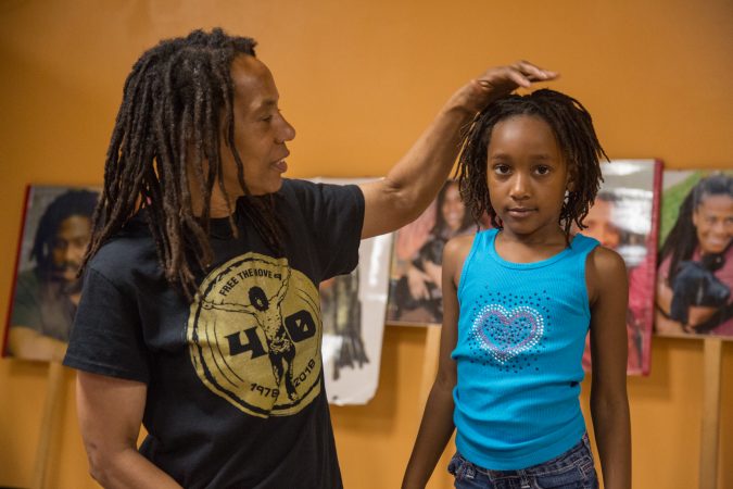 Debbie Africa plays with her granddaughter, Alia, 6, at her first public appearance since being released from prison after 39 years and 10 months of incarceration. (Emily Cohen for WHYY)