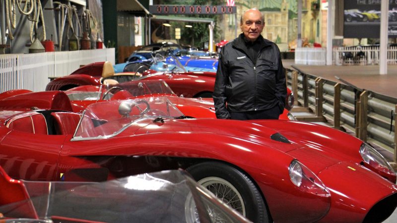 Dr. Fred Simeone stands amid his collection at the Simeone Foundation Automotive Museum, which traces the history of auto racing and emphasizes the value of competition as a spur to progress. (Emma Lee/WHYY)