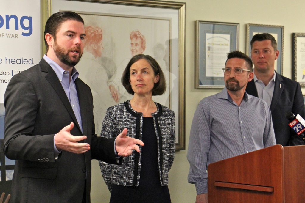 2018 06 06-e lee-joe quinn-philadelphia-headstrong mental health for veterans Joe Quinn (left), executive director of Headstrong, announces that the program that brings free mental health care to veterans and their families is coming to Philadelphia. He is joined by (from left) Deb D'Arcangelo, chief executive officer of Council for Relationships, Gerard Ilaria, clinical director of Headstrong, and former U.S. Army Secretary Patrick Murphy.