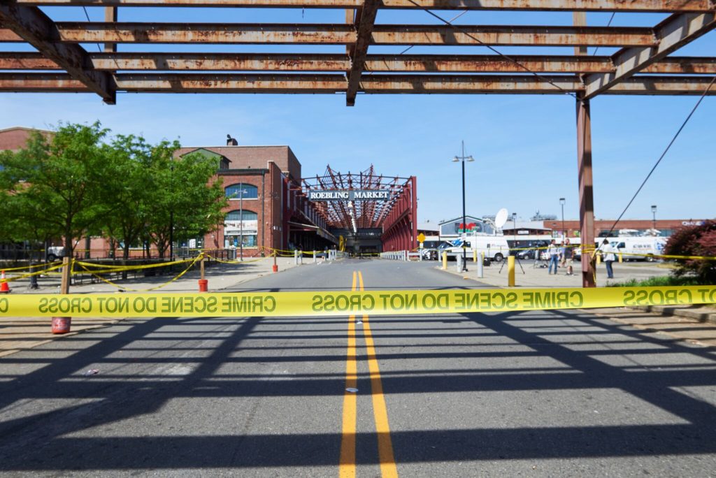2018 06 17-n piserchio-roebling market-trenton nj3_preview Around 2:45 Sunday morning, a dispute among area gangs turned the Art All Night-Trenton festival in the old Roebling Wire Works factory into a crime scene as multiple suspects began shooting at each other. The spree left one suspect dead and 22 people injured, some critically. (Natalie Piserchio/for WHYY)