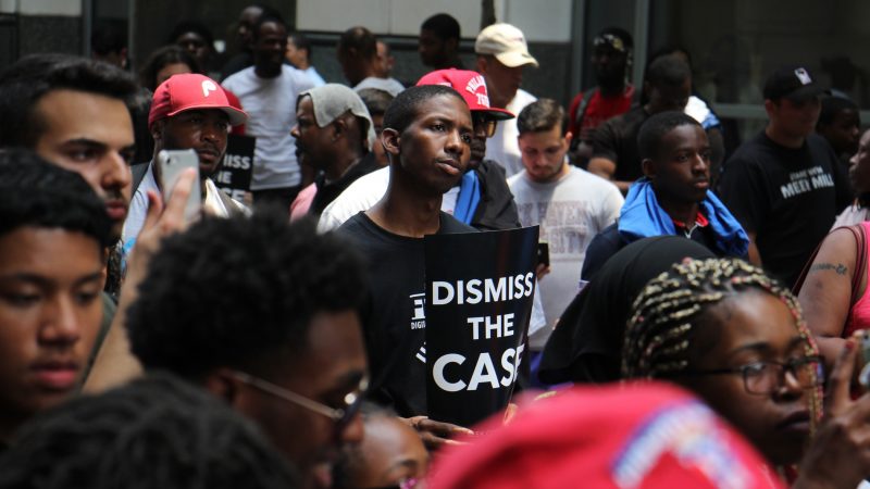 Protesters fill Filbert Street outside  the Criminal Justice Center during a rally for for Meek Mill, who was seeking a new trial on 10-year-old drug and gun charges. (Emma Lee/WHYY)