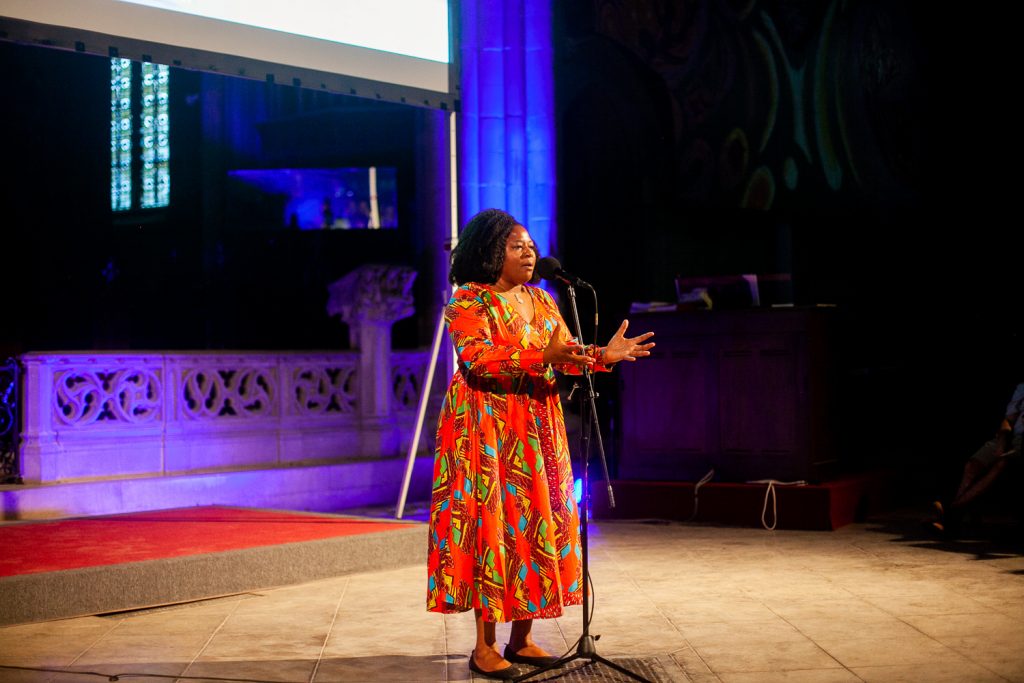 2018 06 21-b larrison north philadelphia – finding sanctuary storytelling event 31 Jos Duncan, a multimedia producer, shares her story at Finding Sanctuary at Church of the Advocate in North Philadelphia. (Brad Larrison for WHYY)