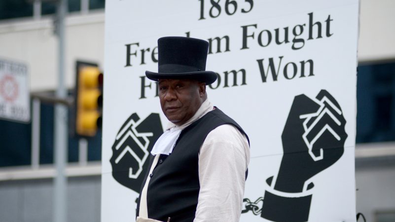 Juneteenth parade floats make their way through Center City on Saturday. (Bastiaan Slabbers for WHYY)