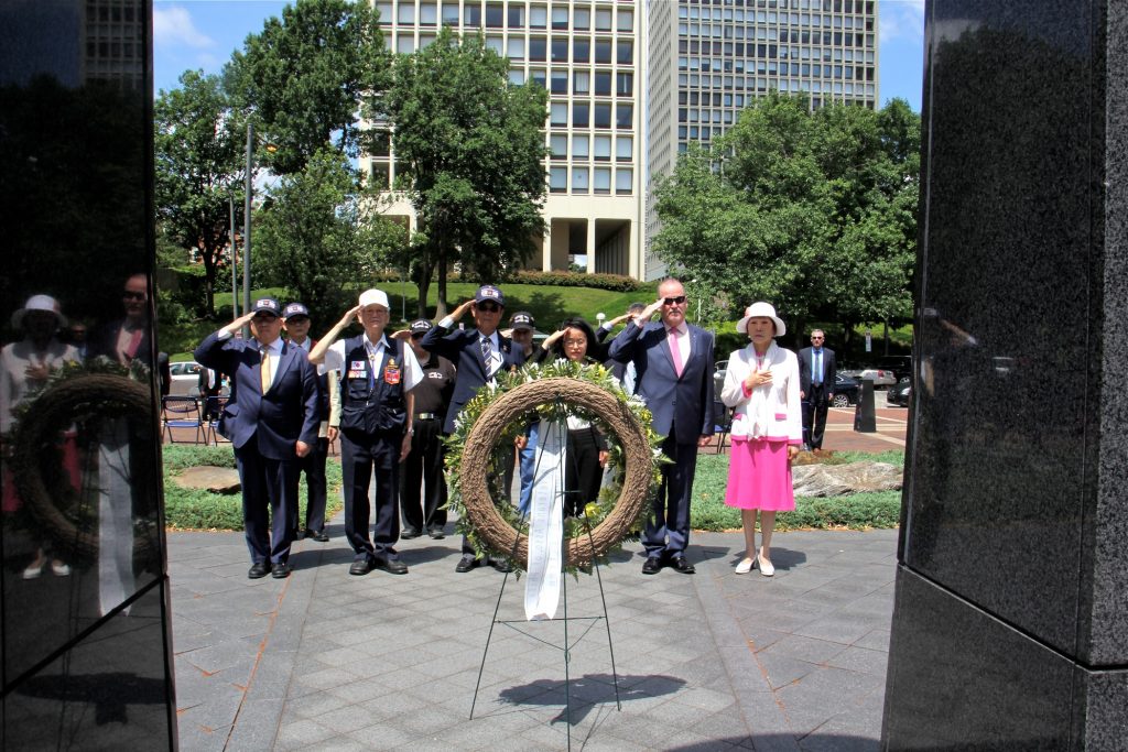 2018 06 25-e lee-philadelphia penns landing korean war memorial-anniversary remembrance Veterans and dignitaries, including political consul Yoon Jung Kim of the Republic of Korea, place a wreath in front of the Korean War Memorial at Penn's Landing during a ceremony held annuallly on the anniversary of the start of the war.