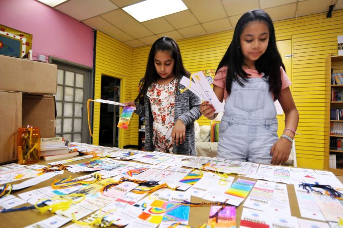Alma, 11, and Yaretzy, 11, made bookmarks at Mighty Writers El Futuro in South Philadelphia Thursday. (Bastiaan Slabbers for WHYY)