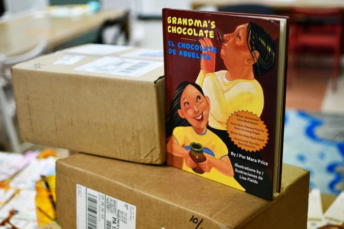 At Mighty Writers El Futuro in South Philadelphia, children donate books and make bookmarks for kids and immigrant families held at the Berks County Detention Center, during a workshop Thursday. (Bastiaan Slabbers for WHYY)