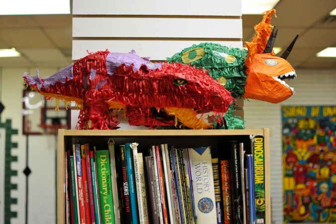 At Mighty Writers El Futuro in South Philadelphia, children donate books and make bookmarks for kids and immigrant families held at the Berks County Detention Center, during a workshop Thursday. (Bastiaan Slabbers for WHYY)