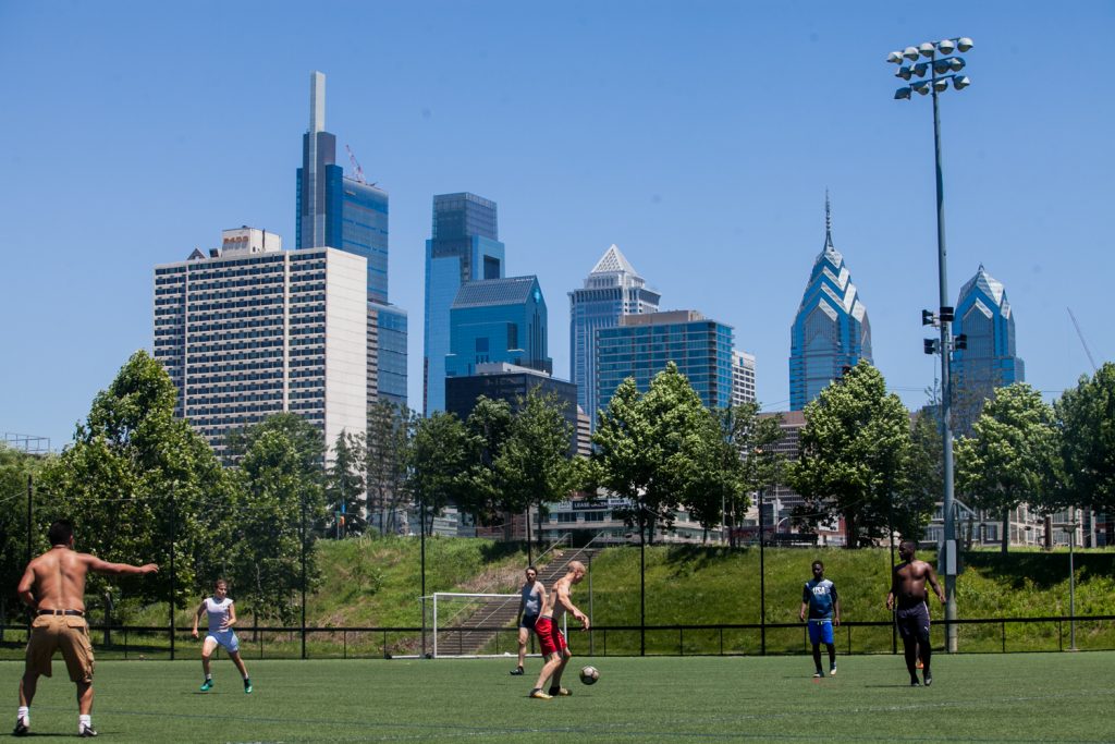 As the World Cup tournament began in Russia on June 14, 2018, some Philadelphians took advantage of a glorious day to play a game in Penn Park. (Brad Larrison for WHYY)