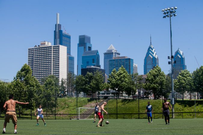 As the World Cup tournament began in Russia on June 14, 2018, some Philadelphians took advantage of a glorious day to play a game in Penn Park. (Brad Larrison for WHYY)
