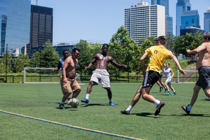 On the opening day of the World Cup in Russia on June 14, 2018, soccer players in Philadelphia enjoy a pickup game Thursday. (Brad Larrison for WHYY)