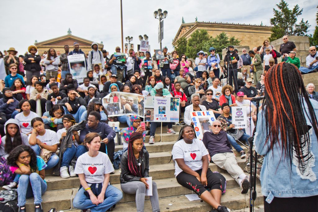 Karmeea Chisolm tells the crowd, “Don’t be fooled by the term ‘mass shooting.' Every life matters,” at the demonstration against gun violence Monday. (Kimberly Paynter/WHYY)