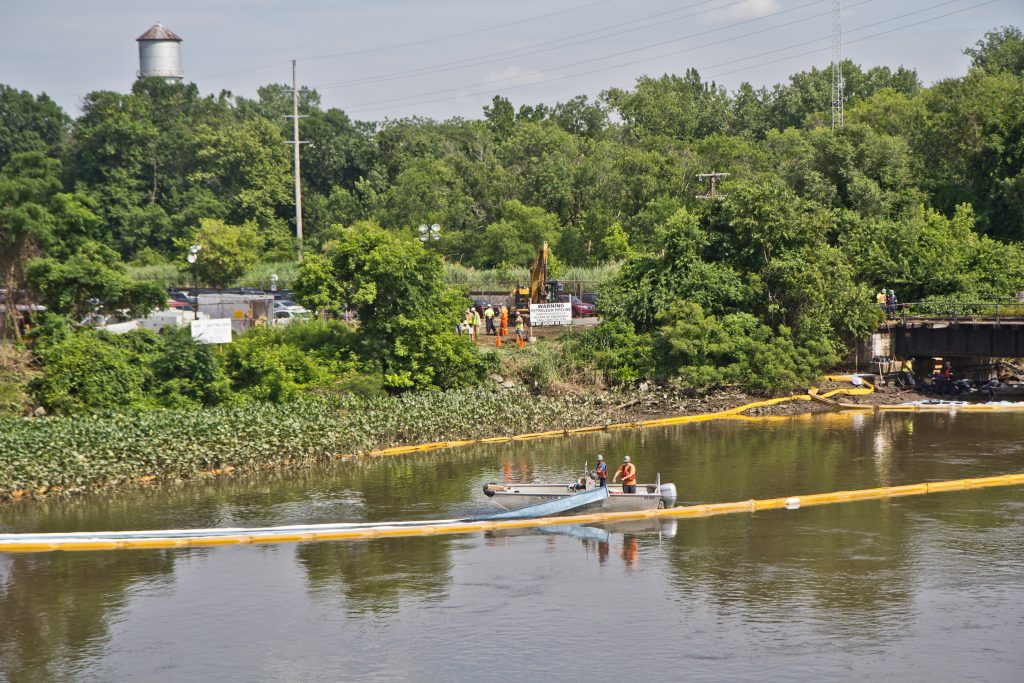 2018 6 21 k paynter darby creek clan up-2 An environmental cleanup crew works to remove fuel from a spill in Darby Creek in Tinicum Township, Pennsylvania, near the Philadelphia International Airport. (Kimberly Paynter/WHYY)