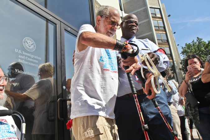A senior citizen's group called The Old Farts were arrested in front of Philadelphia’s ICE headquarters Friday morning in protest of the Trump administration’s family separation policy. (Kimberly Paynter/WHYY)