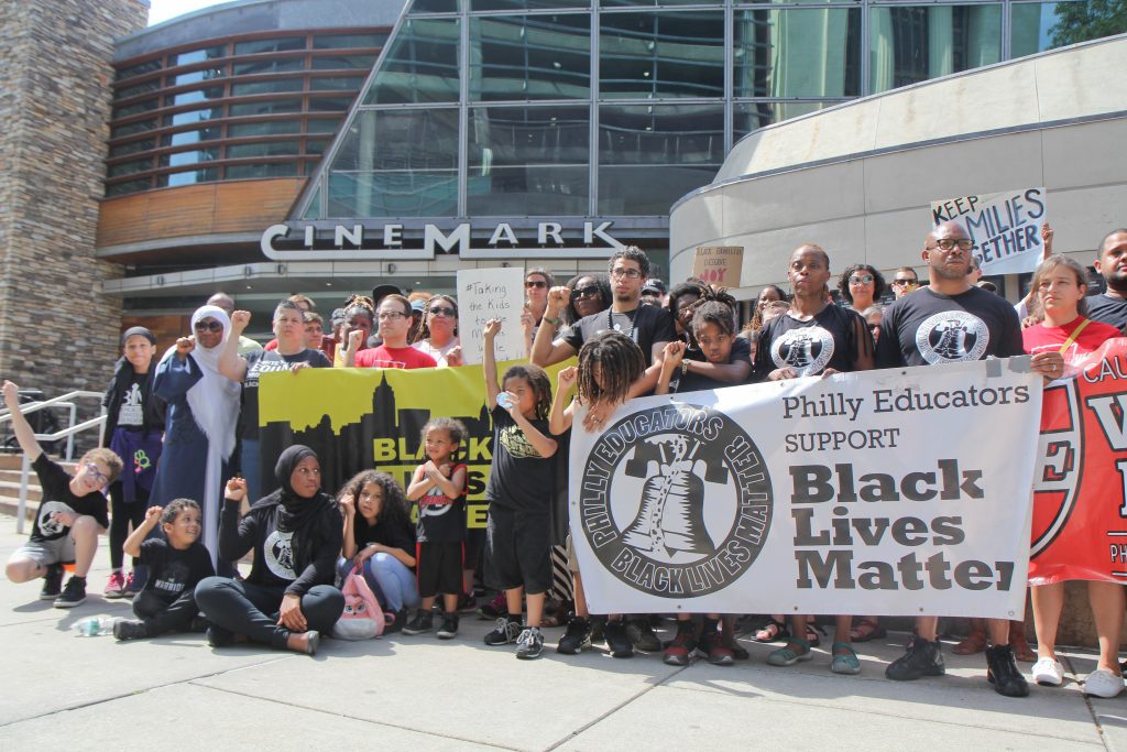 2018 6 30 cinemark Demonstrators rally outside the Cinemark Theatres in Philadelphia. Last week, police were called on a black family who were unsatisfied with their movie experience. (Kimberly Paynter/WHYY)