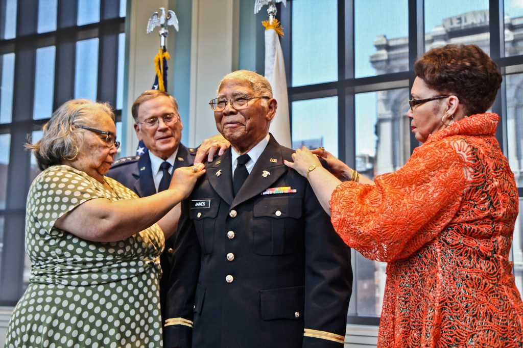 2018 6 30 kpaynter wwii vet_ John Edward James Jr., an Army veteran of World War II, is pinned with the rank of second lieutenant by his daughters Brenda Roberta Watts (left) and Dr. Marion Teresa Lane. (Kimberly Paynter/WHYY)