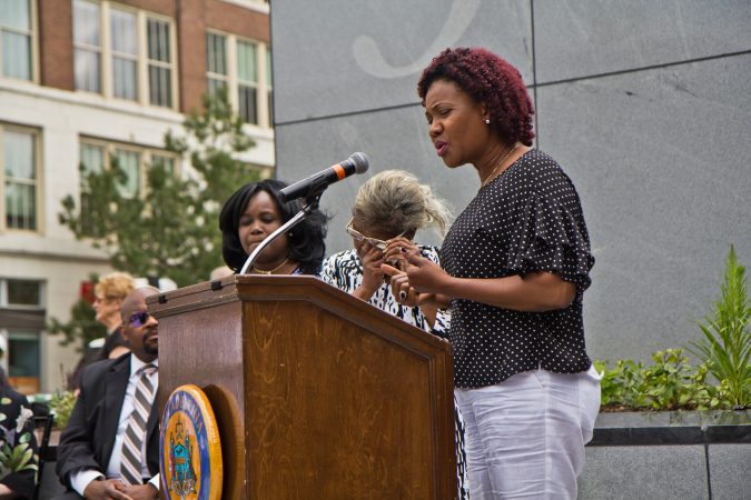 Zhee Vetdier remembers her father, Borbor Davis, who died in the building collapse five years ago. (Kimberly Paynter/WHYY)