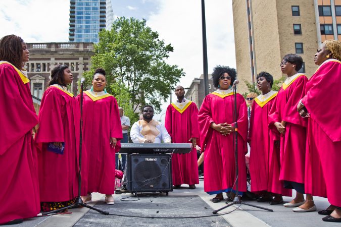 The Faith Immanuel Lutheran Church Choir sings at the dedication of the memorial for people who lost their lives in a building collapse five years ago. (Kimberly Paynter/WHYY)