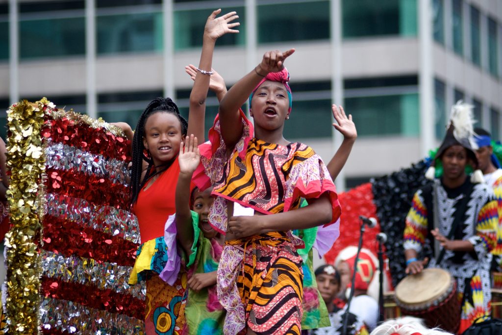 20180623_JuneTeenth_Parade_BS1454 Juneteenth Parade participants wave from their float as they make their way through Center City