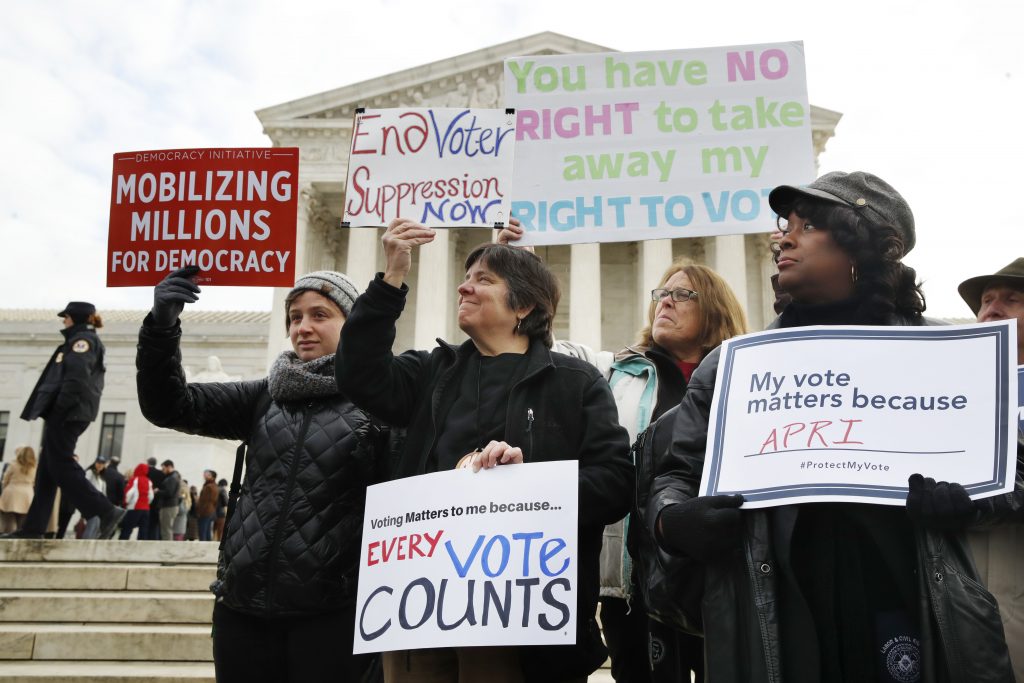 Supreme Court Ohio Voter Rolls People rally outside of the Supreme Court in opposition to Ohio's voter roll purges, Wednesday, Jan. 10, 2018, in Washington.