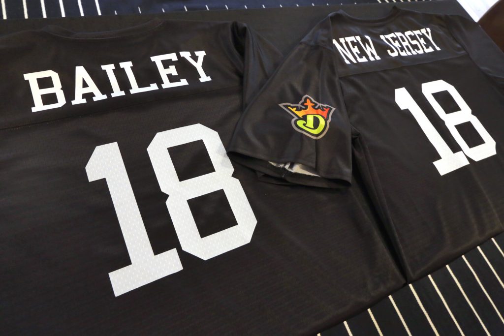 Sports Betting DraftKings Resorts A sports jersey for Morris Bailey, left, the owner of the Resorts Casino Hotel in Atlantic City, N.J., and another for Jason Robins, CEO and co-founder of DraftKings, adorn a table at the offices of DraftKings, in New York, Friday, June 1, 2018. DraftKings and Resorts Casino tell The Associated Press they signed a deal Friday to offer sports betting in New Jersey. (Richard Drew/AP Photo)