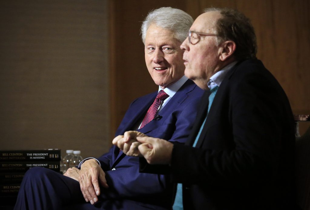 Bill Clinton, Patterson In this file photo, former President Bill Clinton listens as author James Patterson speaks during an interview about their new novel,
