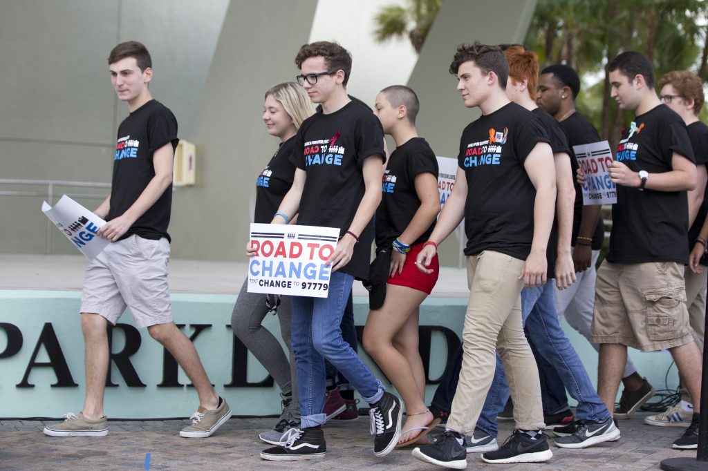 School Shooting Bus Tour A group of Marjory Stoneman Douglas High School students arrive for a news conference, Monday, June 4, 2018, in Parkland, Fla. A day after graduating from high school, the group of Florida school shooting survivors has announced a multistate bus tour to