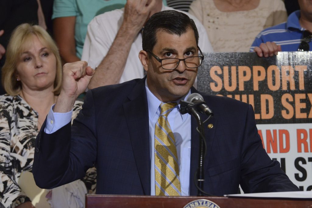 Sex Abuse Cases-Time Limits Rep. Mark Rozzi, D-Berks, speaks at a rally in Pennsylvania's Capitol to support legislation he has written to lift time limits for authorities to pursue charges of child sexual abuse, Tuesday, June 12, 2018 in Harrisburg, Pa. (AP Photo/Marc Levy)