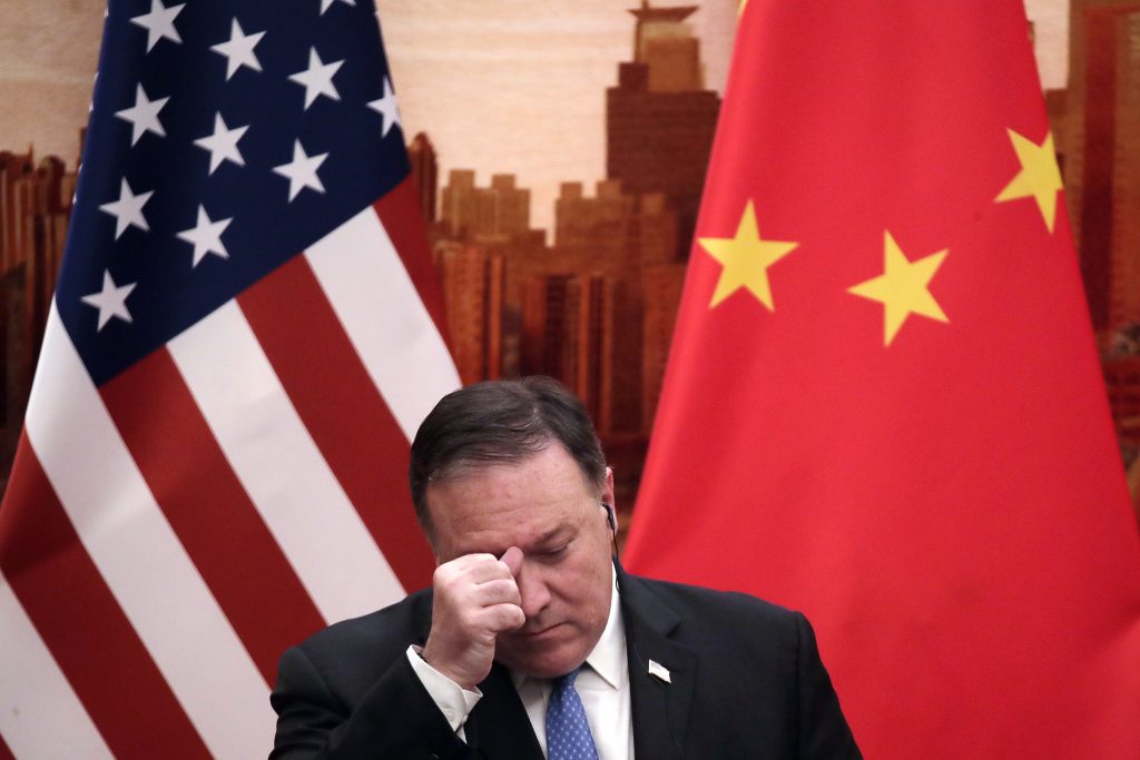 Mike Pompeo U.S. Secretary of State Mike Pompeo rubs his forehead during a joint press conference with Chinese Foreign Minister Wang Yi at the Great Hall of the People in Beijing, Thursday, June 14, 2018. (Andy Wong/AP Photo)
