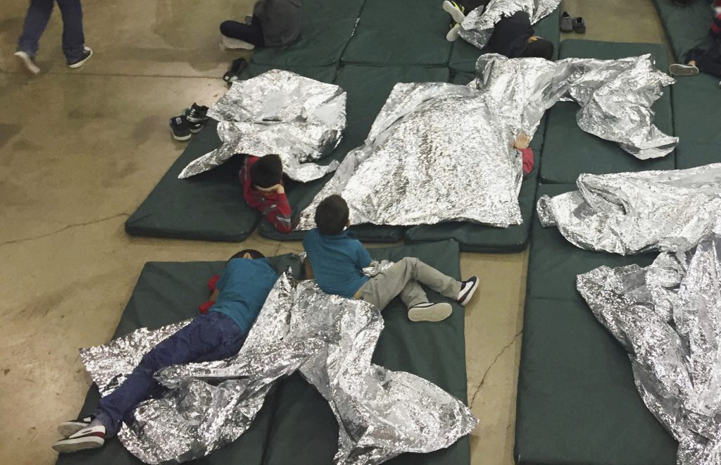 Immigration Holding Facility In this photo provided by U.S. Customs and Border Protection, people who've been taken into custody related to cases of illegal entry into the United States, rest in one of the cages at a facility in McAllen, Texas, Sunday, June 17, 2018.