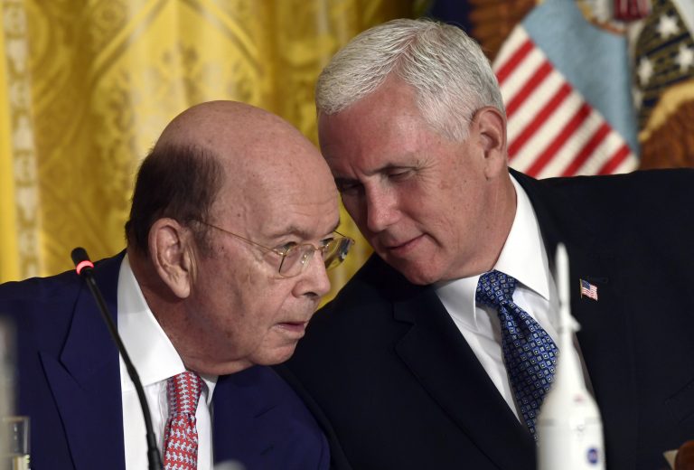 Vice President Mike Pence, right, leans over to talk to Commerce Secretary Wilbur Ross, left, during a National Space Council meeting in the East Room of the White House in Washington, Monday, June 18, 2018. (AP Photo/Susan Walsh)