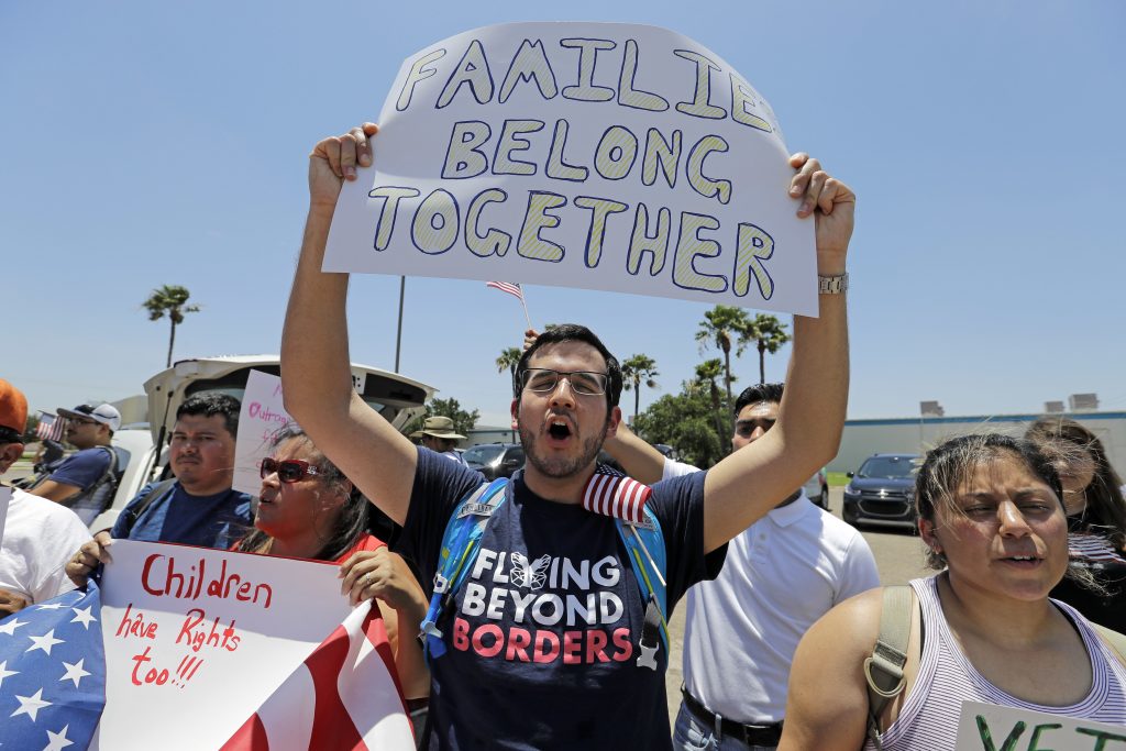 Kristopher Coca Kristopher Coca yells during a protest outside the U.S. Border Patrol Central Processing Center Saturday, June 23, 2018, in McAllen, Texas. The protest occurred amid an uproar over the Trump administration's practice of separating immigrant families caught on the southwest border. President Donald Trump signed an order this week to keep families detained together during immigration proceedings. (AP Photo/David J. Phillip)