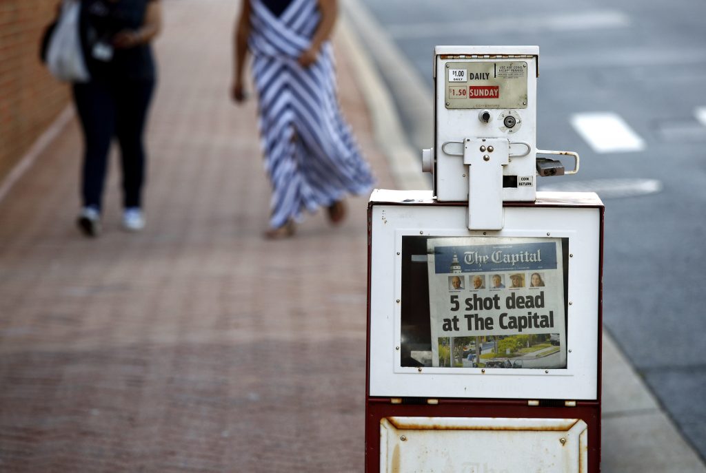 James Wolfe A Capital Gazette newspaper rack displays the day's front page, Friday, June 29, 2018, in Annapolis, Md. A man armed with smoke grenades and a shotgun attacked journalists in the newspaper's building Thursday, killing several people before police quickly stormed the building and arrested him, police and witnesses said. (Patrick Semansky/AP Photo)