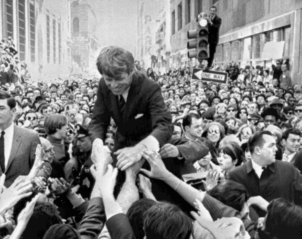 Robert F. Kennedy In this April 2, 1968 file photo U.S. Sen. Robert F. Kennedy, D-NY, shakes hands with people in a crowd while campaigning for the Democratic party's presidential nomination on a street corner, in Philadelphia. (Warren Winterbottom/AP Photo, File)
