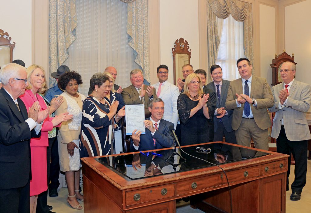 Bump Stocks 1 Delaware Gov. John Carney signs legislation banning bump stock devices Thursday. (Courtesy of Jen Rini)