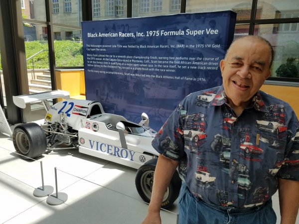 Leonard Miller at the Mercer Museum, with the Formula Vee car his team – the Black American Racers – raced. (Peter Crimmins/WHYY)